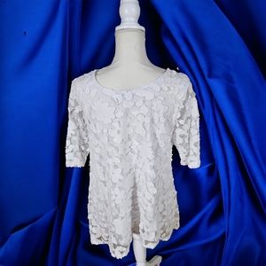 White lace top; stretchable fabric; fits below the waist